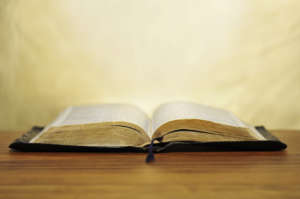 Old bible on golden background
